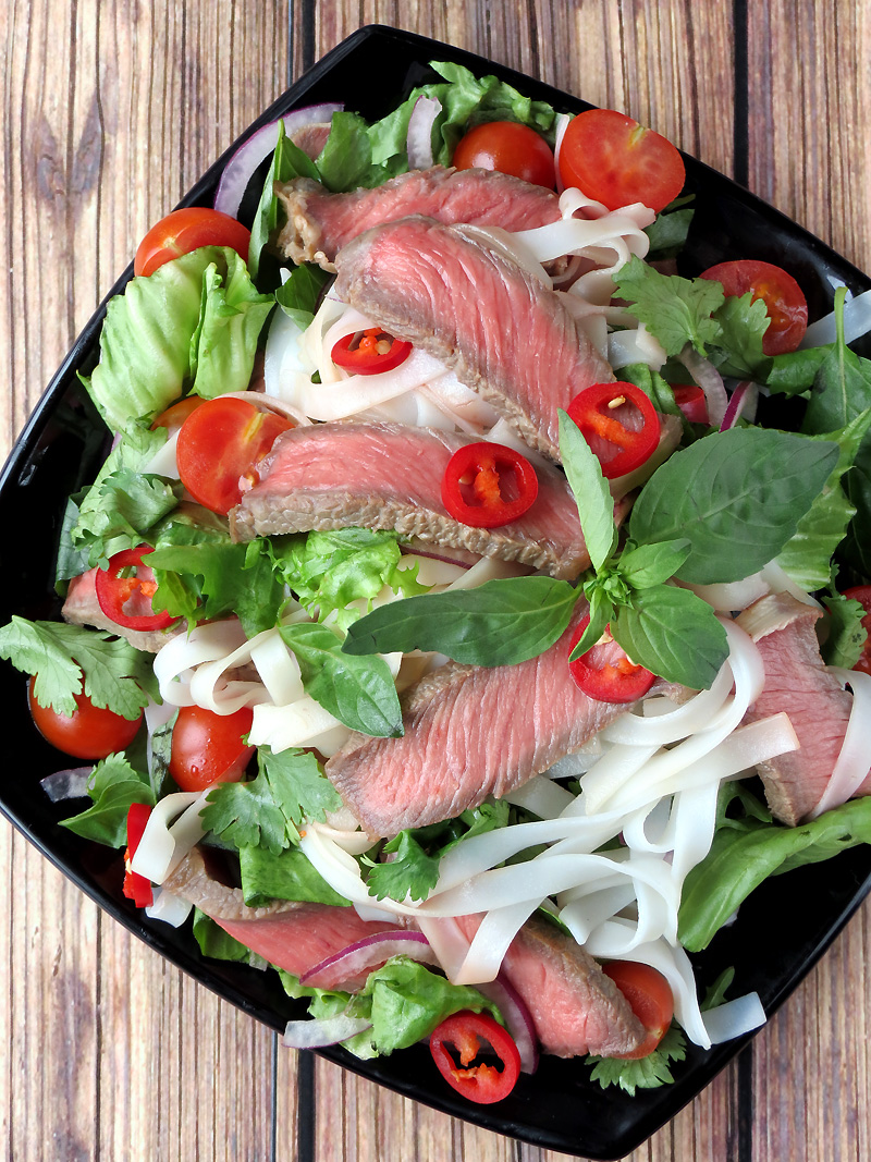 Vietnamese Beef Noodle Salad garnished with basil leaves