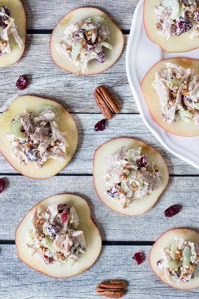 If you are looking for a perfect appetizer, this Cranberry Chicken Salad on crunchy and fresh apple slices is exactly what you need! | yummyaddiction.com