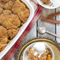 This Sweet Potato Cobbler is full of cinnamon, nutmeg and cloves flavor. Topped with a buttery crust and served with a dollop of ice cream on top! | yummyaddiction.com