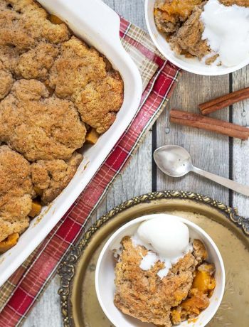 This Sweet Potato Cobbler is full of cinnamon, nutmeg and cloves flavor. Topped with a buttery crust and served with a dollop of ice cream on top! | yummyaddiction.com