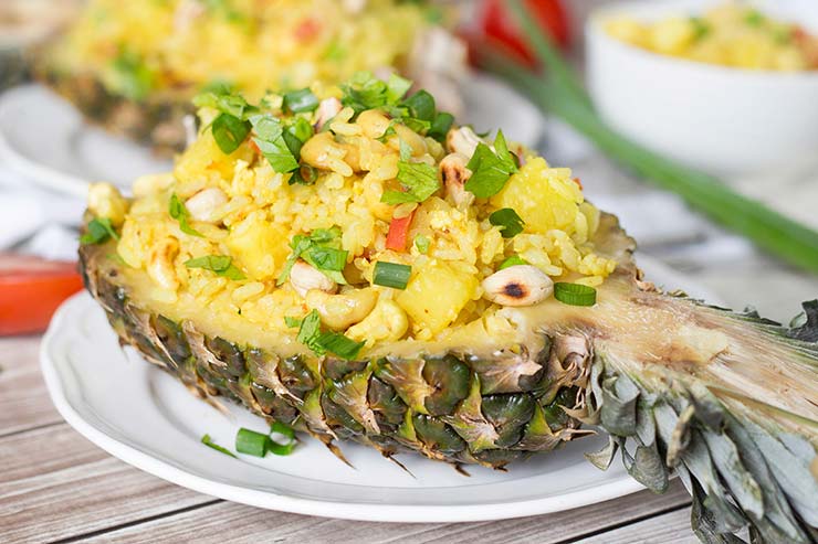 Thai pineapple fried rice served in pineapple shells