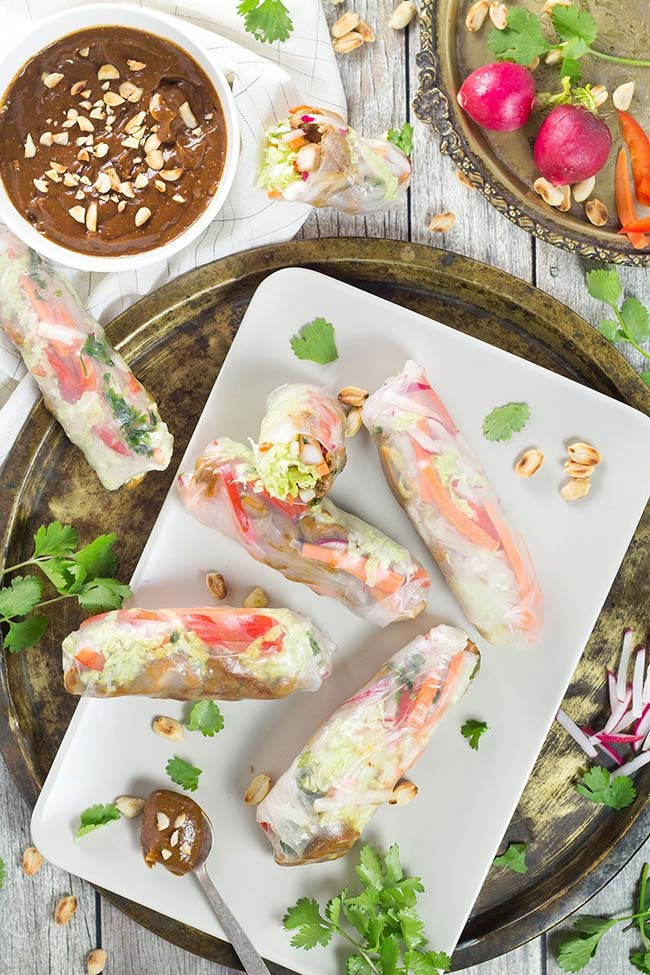 These Rice Paper Rolls, stuffed with chicken, veggies, and served with a fantastic peanut dipping sauce, make a perfect snack, appetizer or a light dinner! | yummyaddiction.com