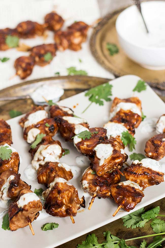Peanut Butter Chicken is a perfect choice when you need some variety. Weaved onto skewers and served alongside a yogurt-dill sauce, it makes for a fantastic dinner! | yummyaddiction.com