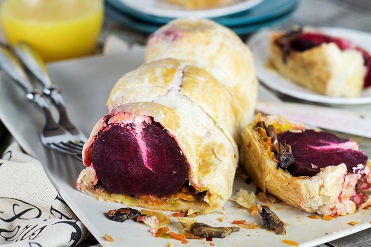This Vegetable Wellington is a vegetarian variation of the classic dish. It is packed with goat cheese stuffed whole beets, carrots, leek, and mushrooms! | yummyaddiction.com