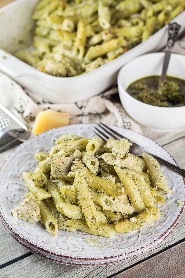 Looking for a perfect weeknight dinner? This Basil Pesto Chicken Pasta Bake is exactly what you need. Easy and quick to make + crazy delicious! | yummyaddiction.com