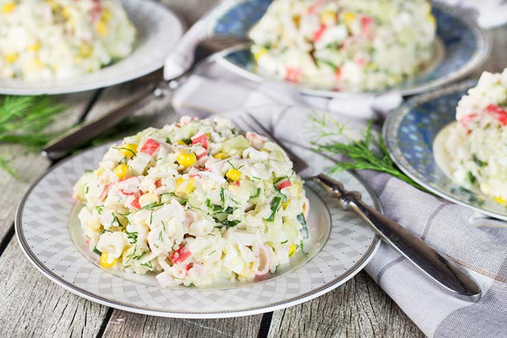 Check out this Russian version of the Imitation Crab Salad. Featuring corn, rice, eggs, and cucumber, it's comforting, filling, and crazy delicious! | yummyaddiction.com