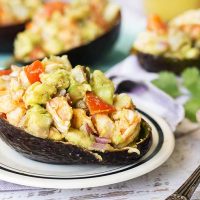 These Chili-Lime Shrimp Stuffed Avocado Shells make a perfect summer meal. Fresh, filling, and full of flavor, they can be eaten as an appetizer, lunch, or a light dinner! | yummyaddiction.com