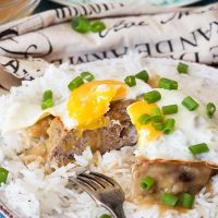 Loco Moco is an iconic Hawaiian dish. A bed of rice is topped with a juicy beef patty, a fried egg, and then drowned in delicious brown gravy! | yummyaddiction.com