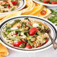 This Tuna Pasta Salad ticks all the boxes. Featuring green beans, potatoes, and tomatoes, it's nutritious, light but filling, and full of flavor! | yummyaddiction.com