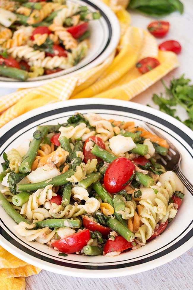 This Tuna Pasta Salad ticks all the boxes. Featuring green beans, potatoes, and tomatoes, it's nutritious, light but filling, and full of flavor! | yummyaddiction.com