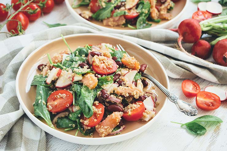 This Smoked Salmon and Quinoa Salad also features radishes, beans, tomatoes, spinach, and a gorgeous sesame oil dressing. Delicious, filling, and nutritious! | yummyaddiction.com