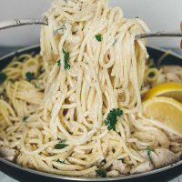 This Easy Chicken Spaghetti is drowned in a flavorful Parmesan Lemon Cream Sauce. Ready in under 30 minutes, it makes a great weeknight dinner! | yummyaddiction.com