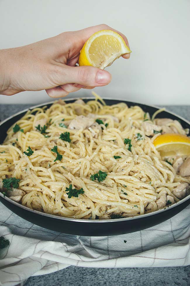 This Easy Chicken Spaghetti is drowned in a flavorful Parmesan Lemon Cream Sauce. Ready in under 30 minutes, it makes a great weeknight dinner! | yummyaddiction.com