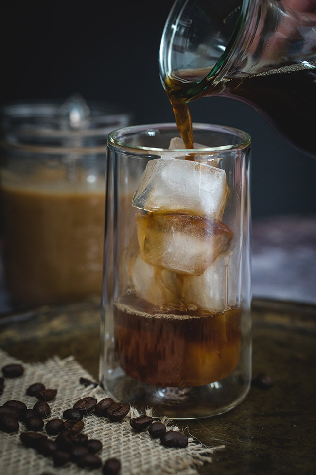 Pouring coffee over ice
