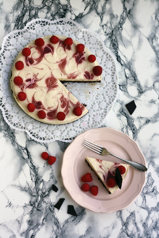 Healthy Brownie Cheesecake topped with fresh raspberries