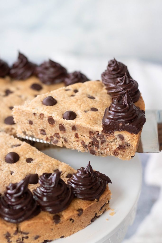 A slice of a grain-free chocolate chip cookie cake