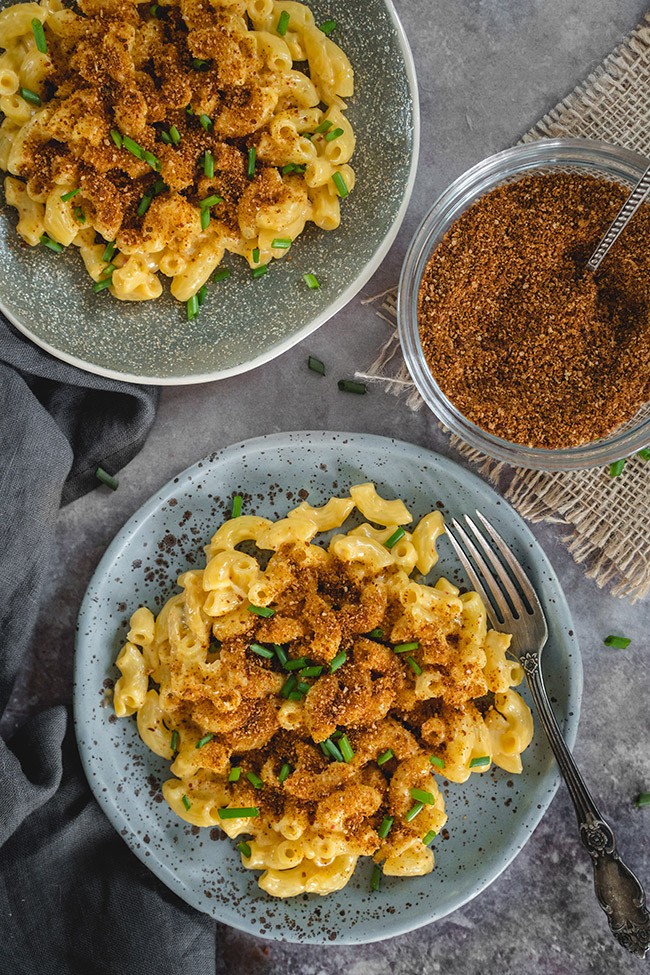 Plates of mac and cheese with kimchi topping