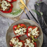 Quinoa and mushroom stuffed peppers on a plate
