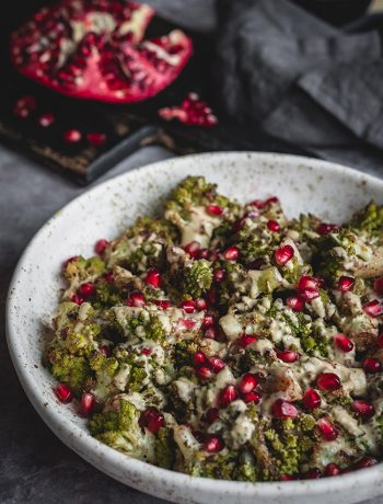 Romanesco side dish with tahini dressing and pomegranate seeds