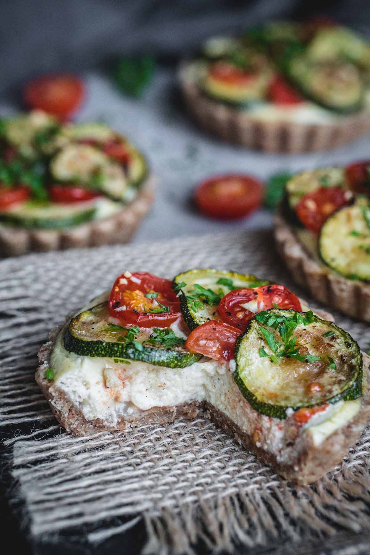 Sliced zucchini and tomato tartlet