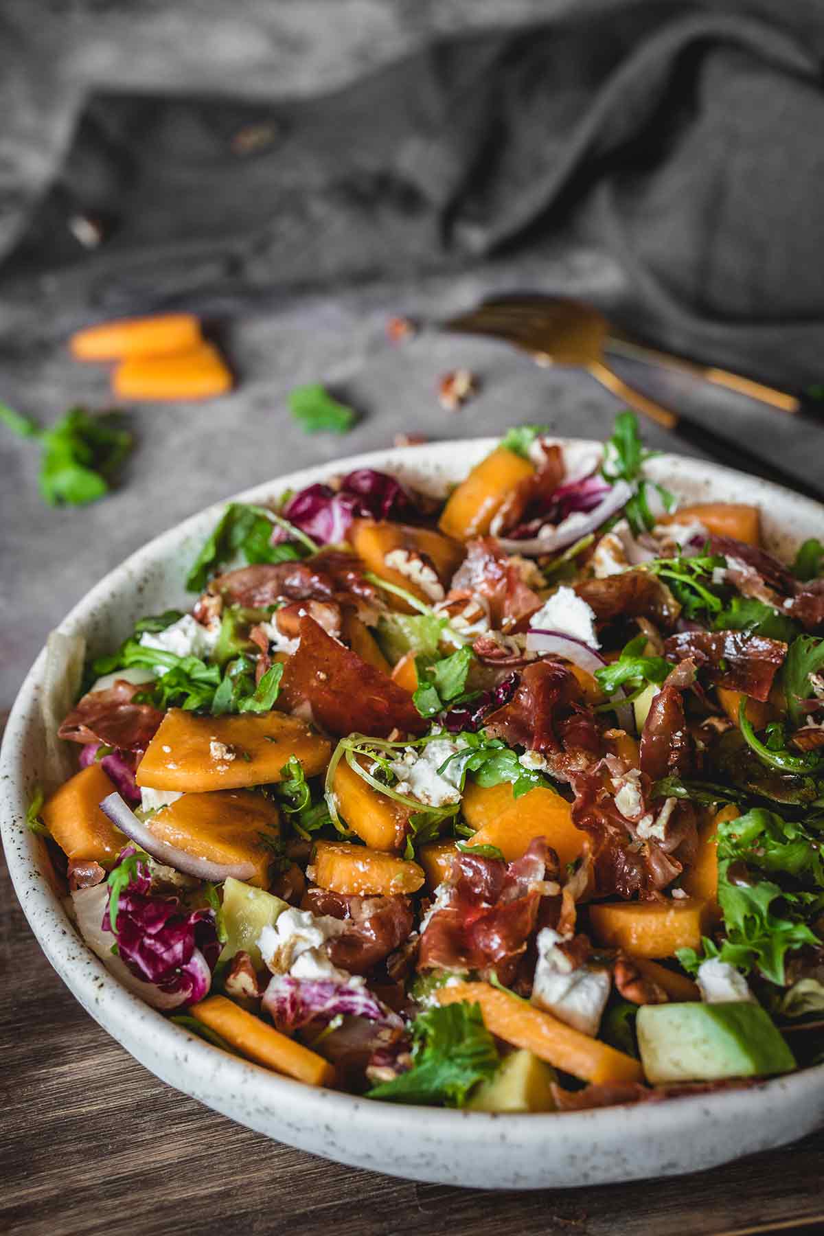 Cantaloupe salad with prosciutto in a bowl
