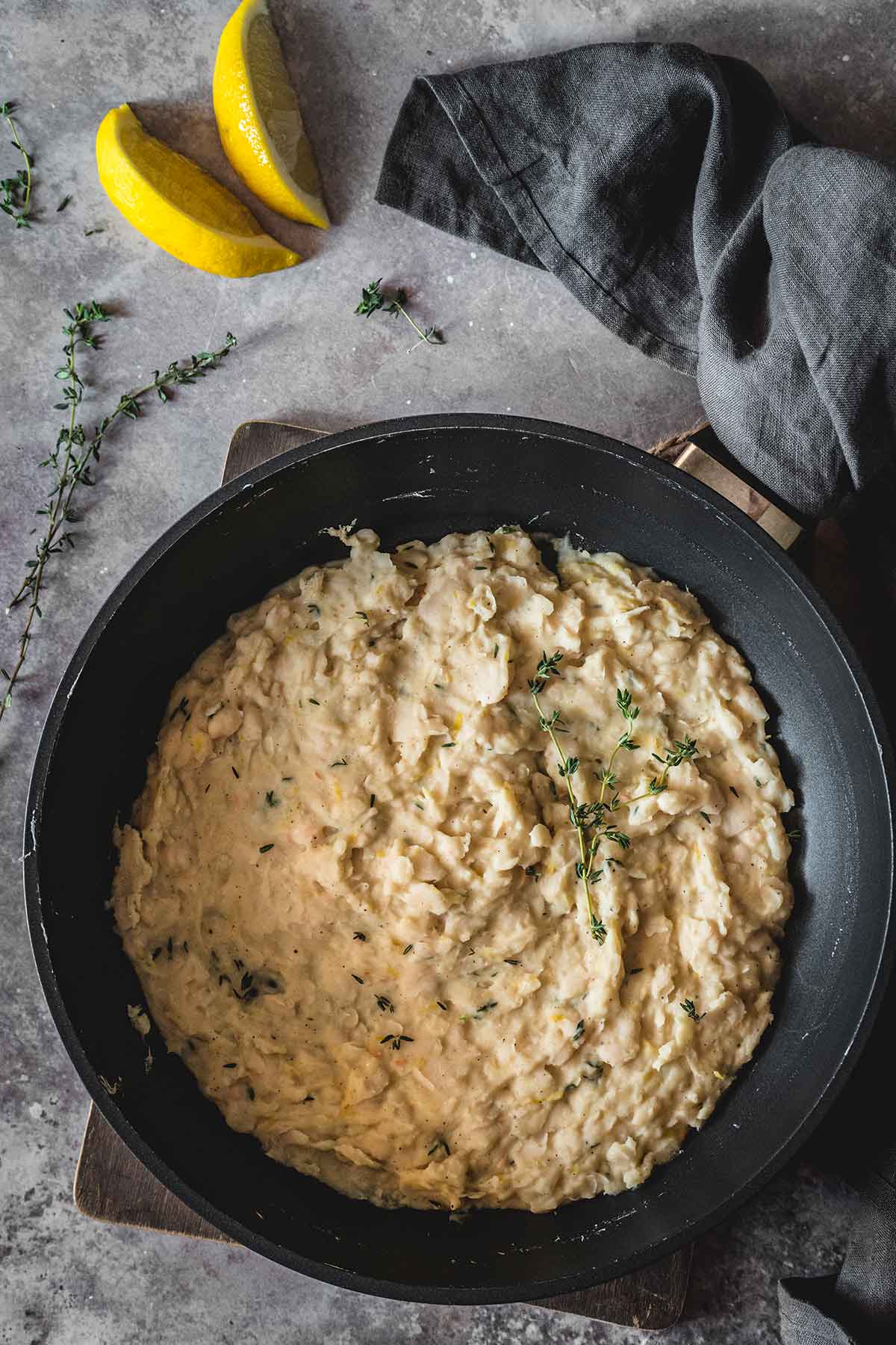 Mashed white beans in a skillet