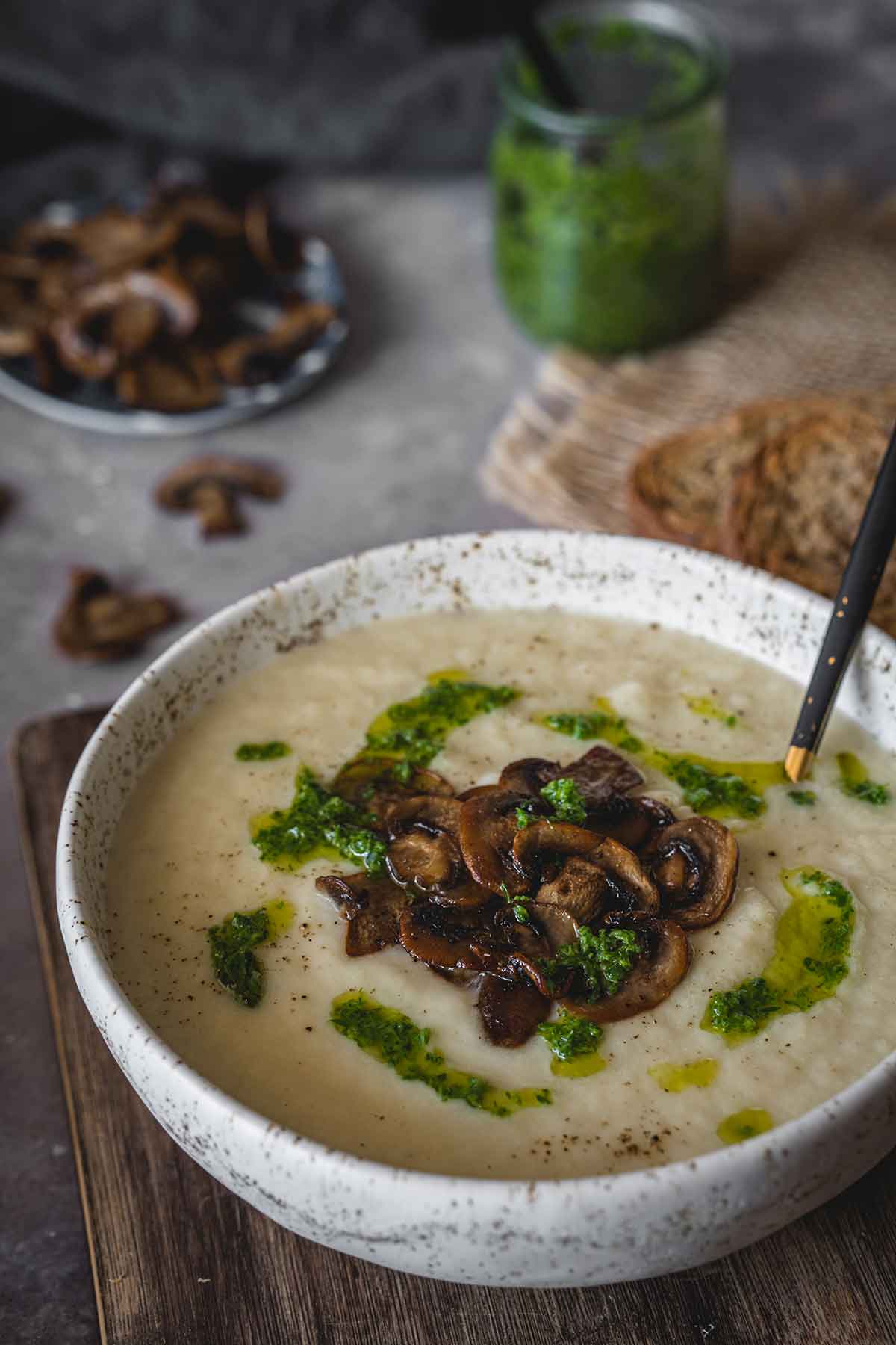 Celery root soup with mushrooms in a bowl