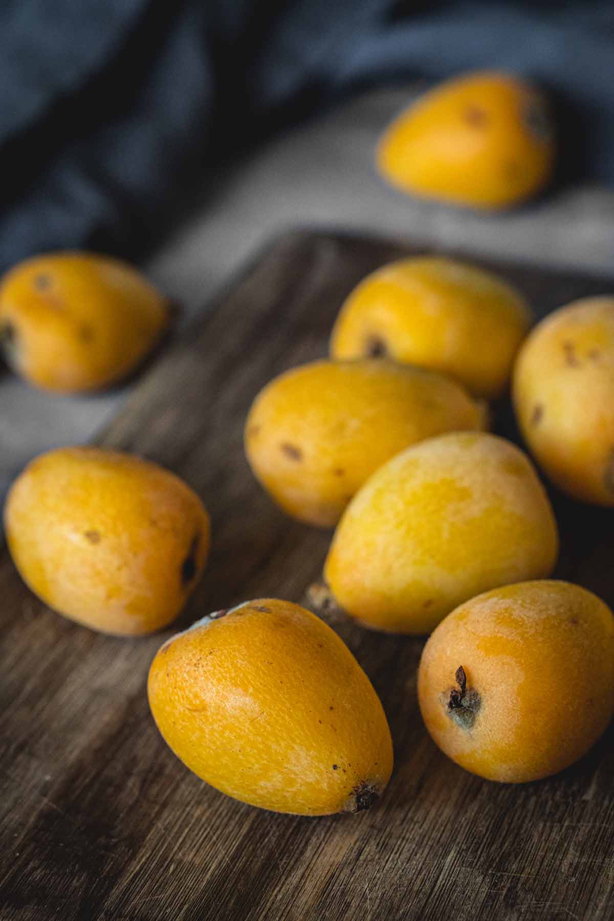 Whole loquat fruits on a table