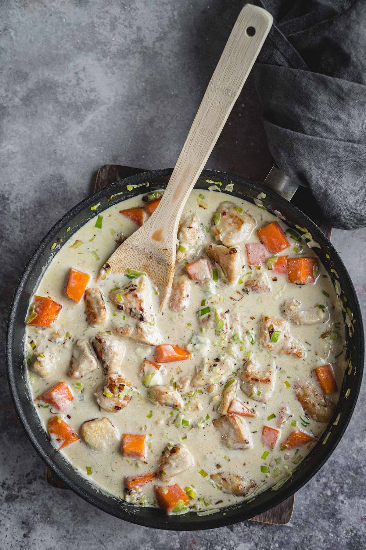 The process of making vegetable chicken casserole in a skillet
