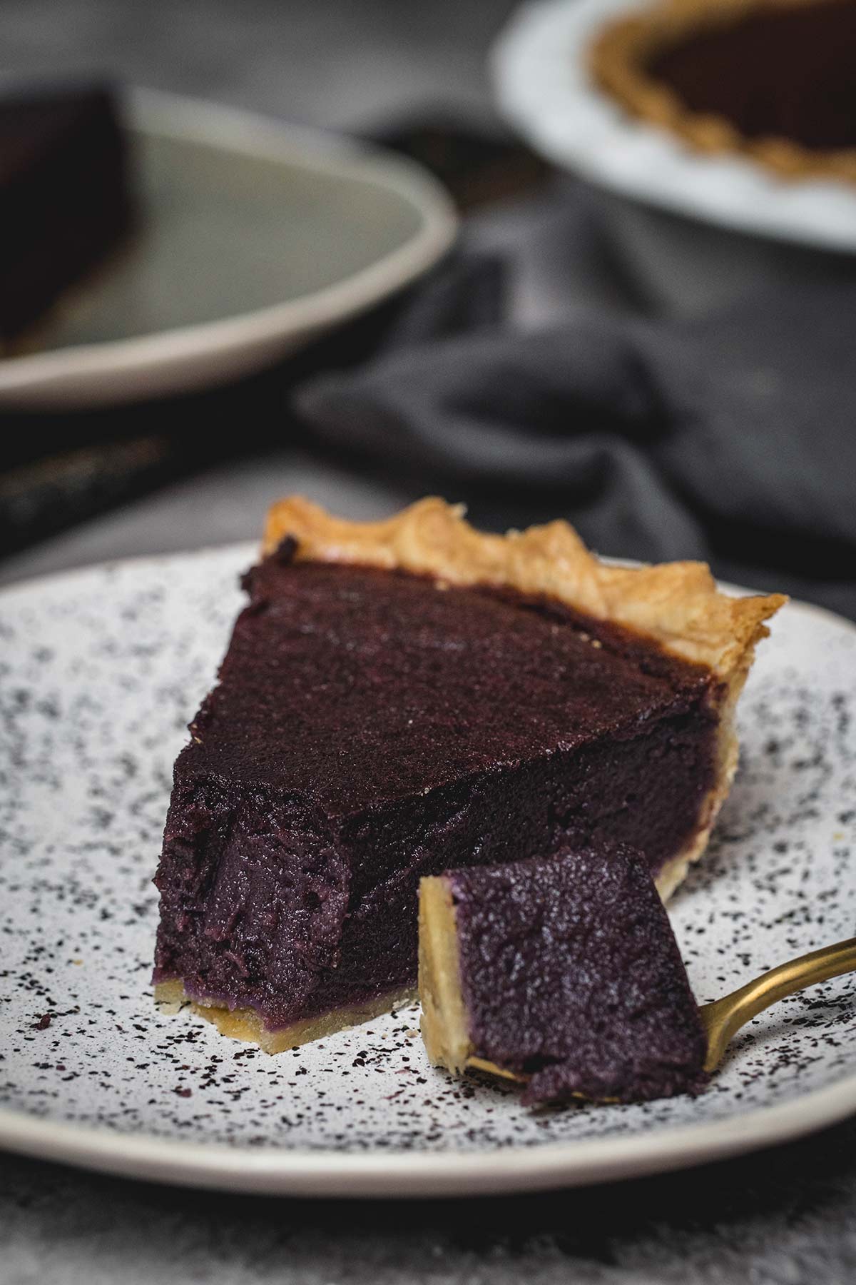 A bite of pie with purple sweet potato filling