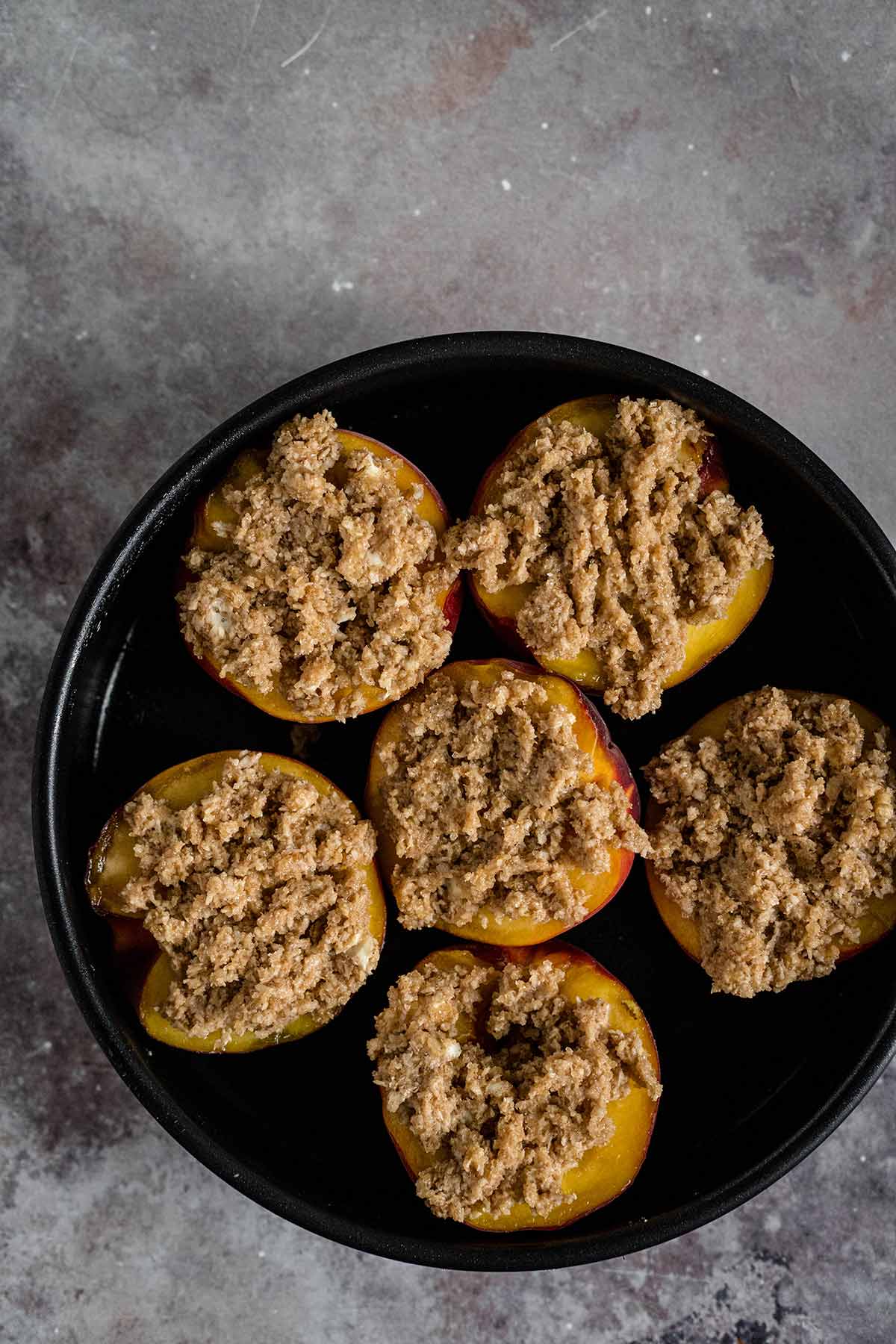 Peaches topped with brown sugar and coconut